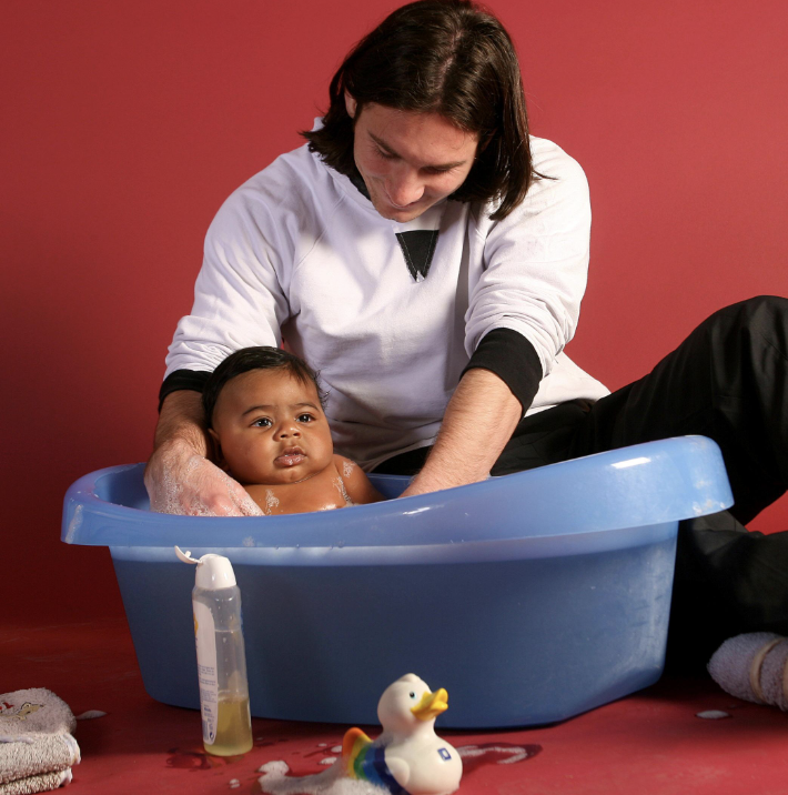 Lionel Messi with baby Lamine Yamal